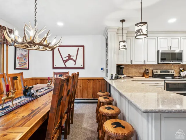 a very nice looking kitchen with a large window