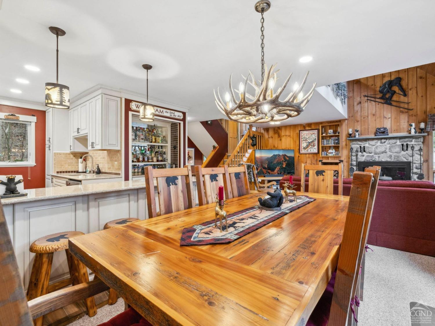 57 Brainard Ridge Road, Unit 3E Windham, NY 12496 - Photo 19 of 55 a room with table chairs and kitchen view