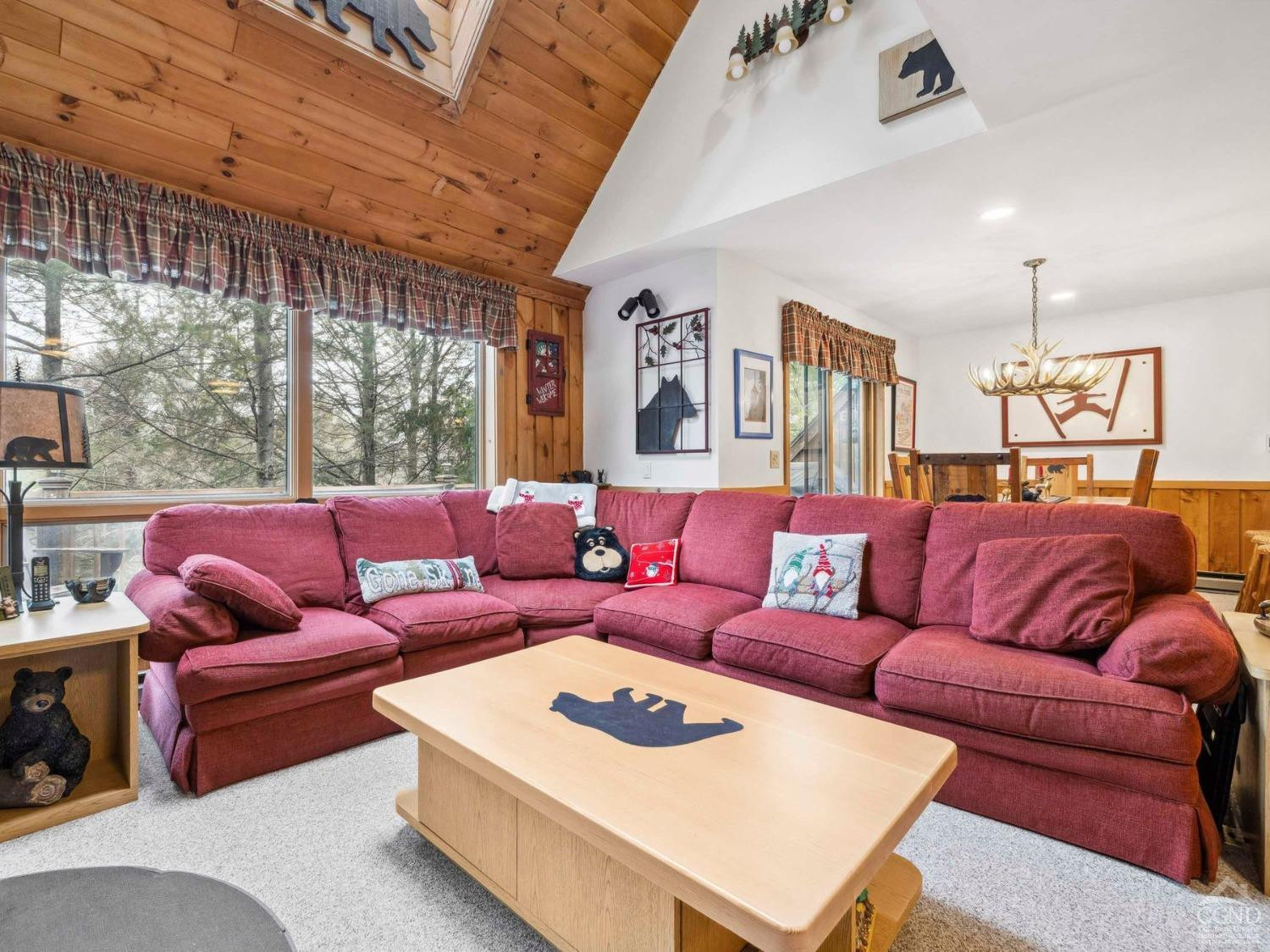 57 Brainard Ridge Road, Unit 3E Windham, NY 12496 - Photo 20 of 55 a living room with furniture and a large window