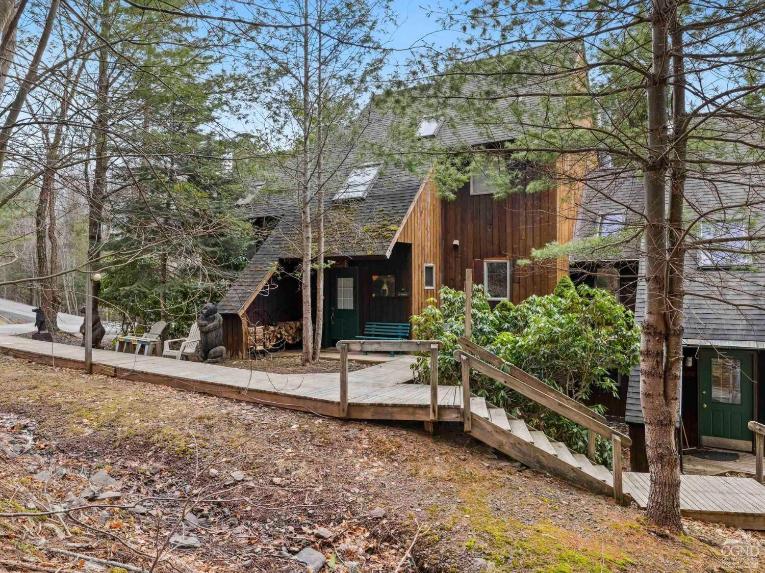 57 Brainard Ridge Road, Unit 3E Windham, NY 12496 - Photo 2 of 55 a backyard of a house with lots of green space