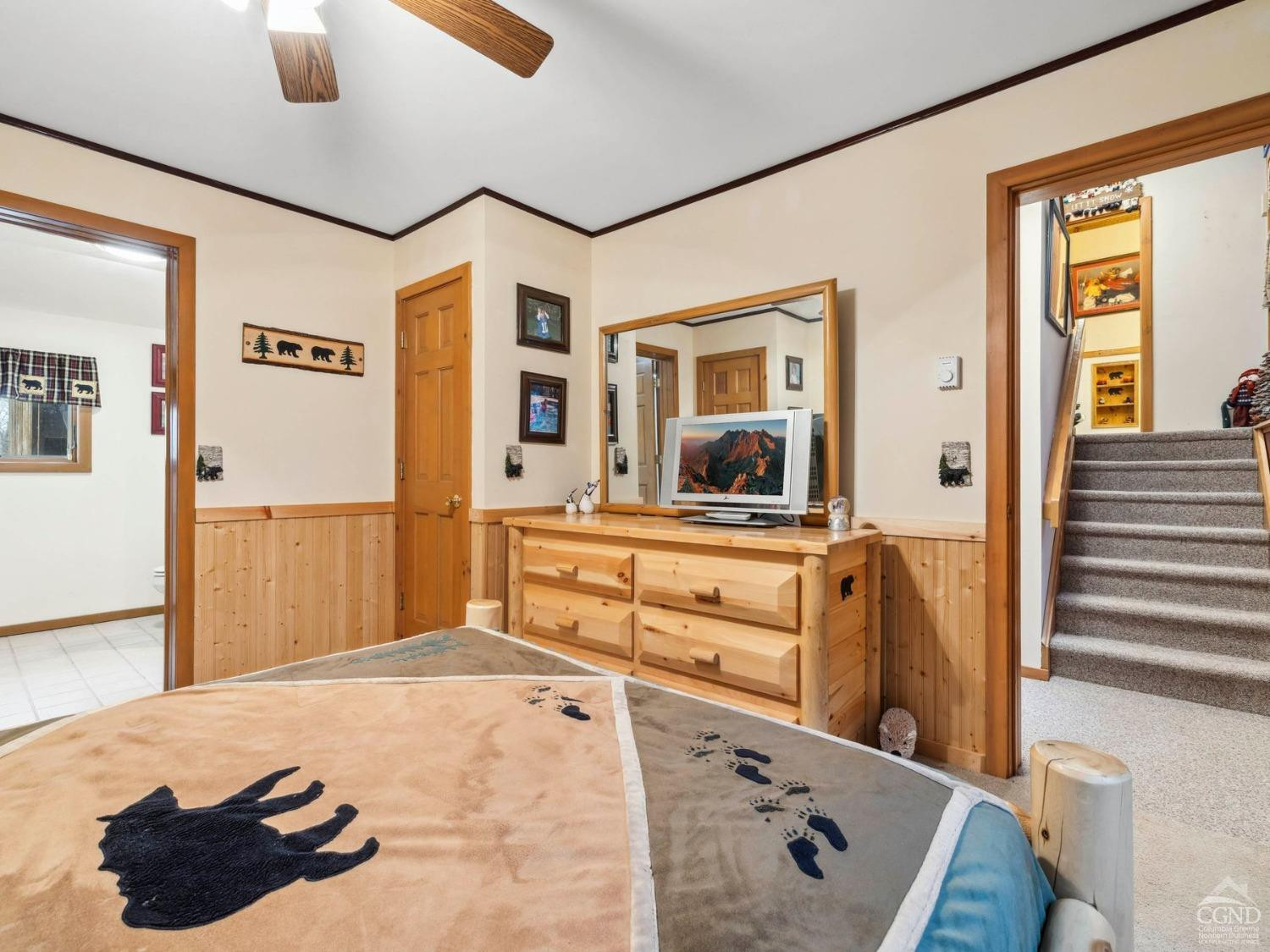 57 Brainard Ridge Road, Unit 3E Windham, NY 12496 - Photo 27 of 55 a bedroom with a bed and wooden floor