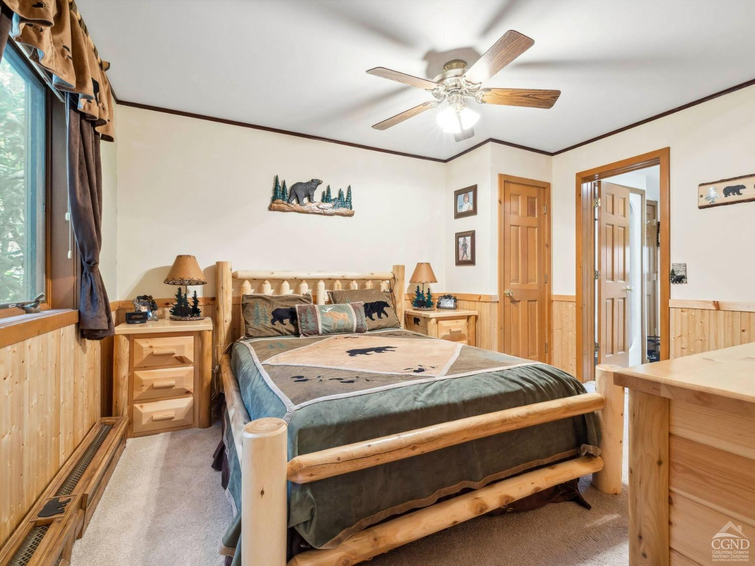 57 Brainard Ridge Road, Unit 3E Windham, NY 12496 - Photo 29 of 55 a bedroom with a bed and a chandelier