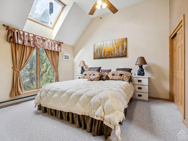 a bedroom with a bed and cupboard