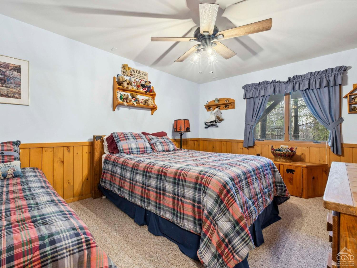 57 Brainard Ridge Road, Unit 3E Windham, NY 12496 - Photo 42 of 55 a bedroom with a bed and a chandelier