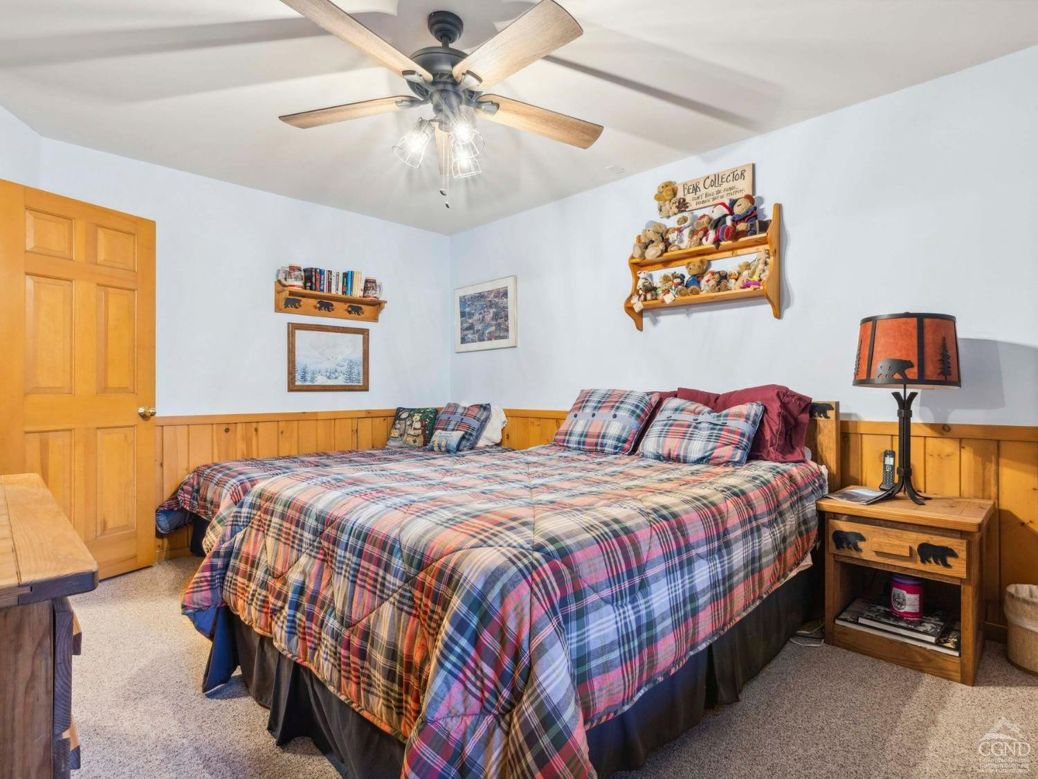 57 Brainard Ridge Road, Unit 3E Windham, NY 12496 - Photo 43 of 55 a bedroom with a bed and a chandelier