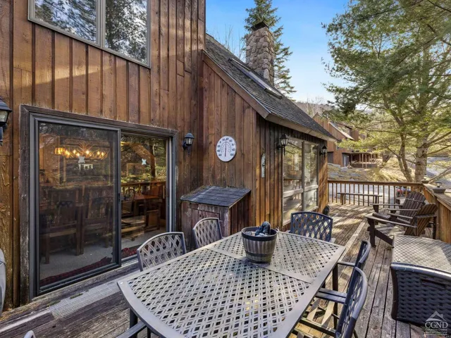 a small garden with a bench and potted plants