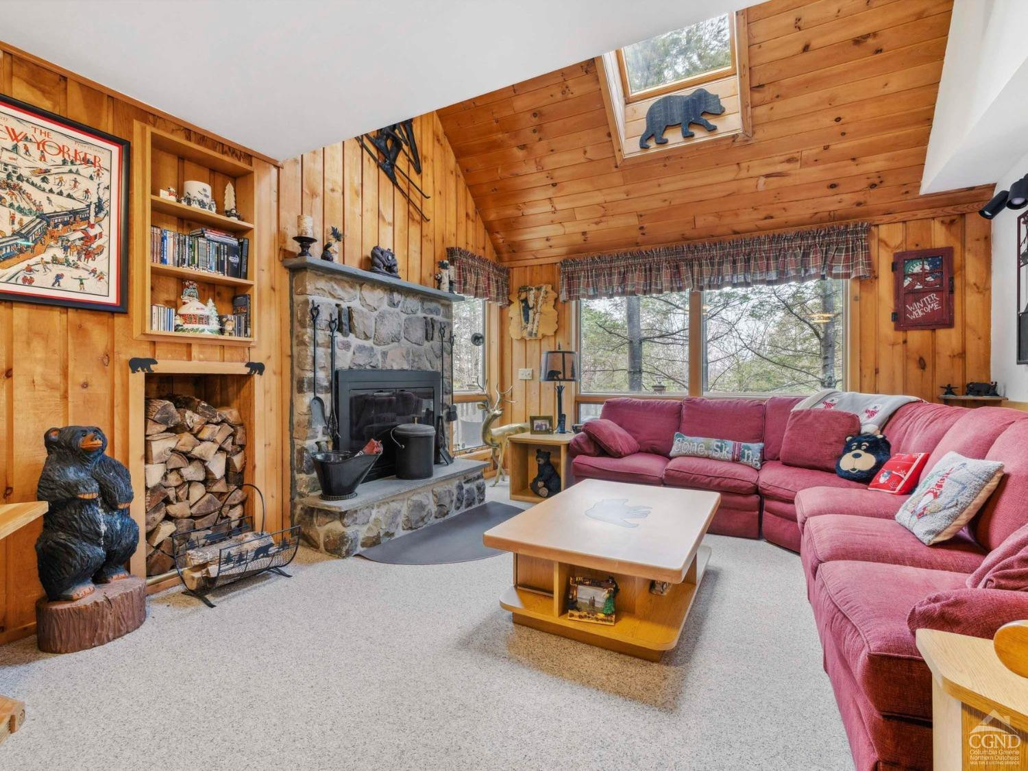 57 Brainard Ridge Road, Unit 3E Windham, NY 12496 - Photo 8 of 55 a living room with furniture a fireplace and floor to ceiling windows