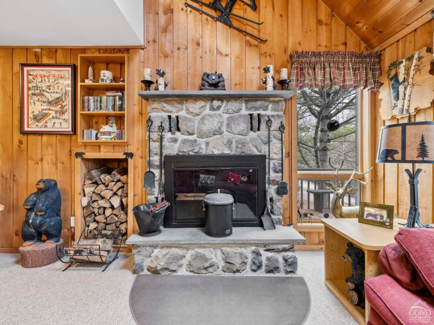 57 Brainard Ridge Road, Unit 3E Windham, NY 12496 - Photo 9 of 55 a living room with fireplace furniture and a fireplace