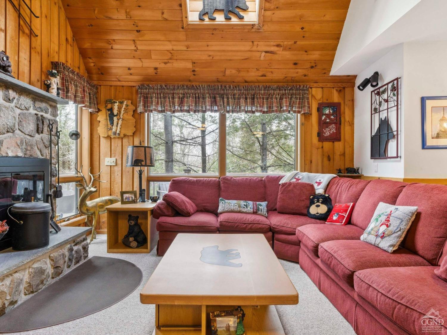 57 Brainard Ridge Road, Unit 3E Windham, NY 12496 - Photo 10 of 55 a living room with furniture and a large window