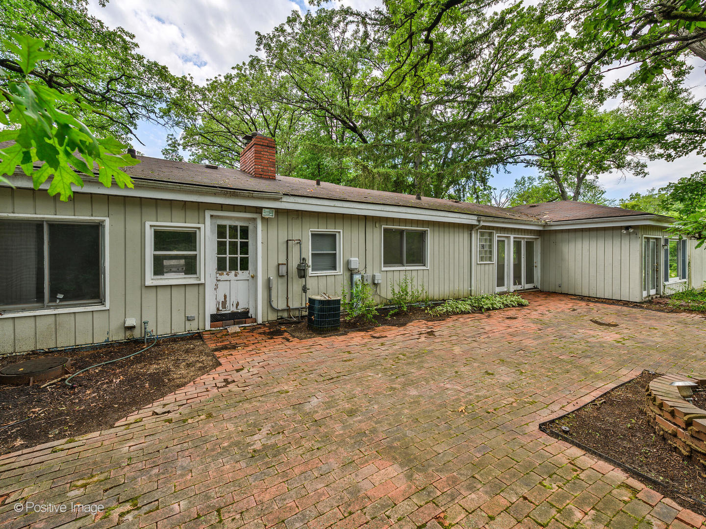 1360 West Everett Road Lake Forest, IL 60045 - Photo 11 of 14 a front view of a house with a garden