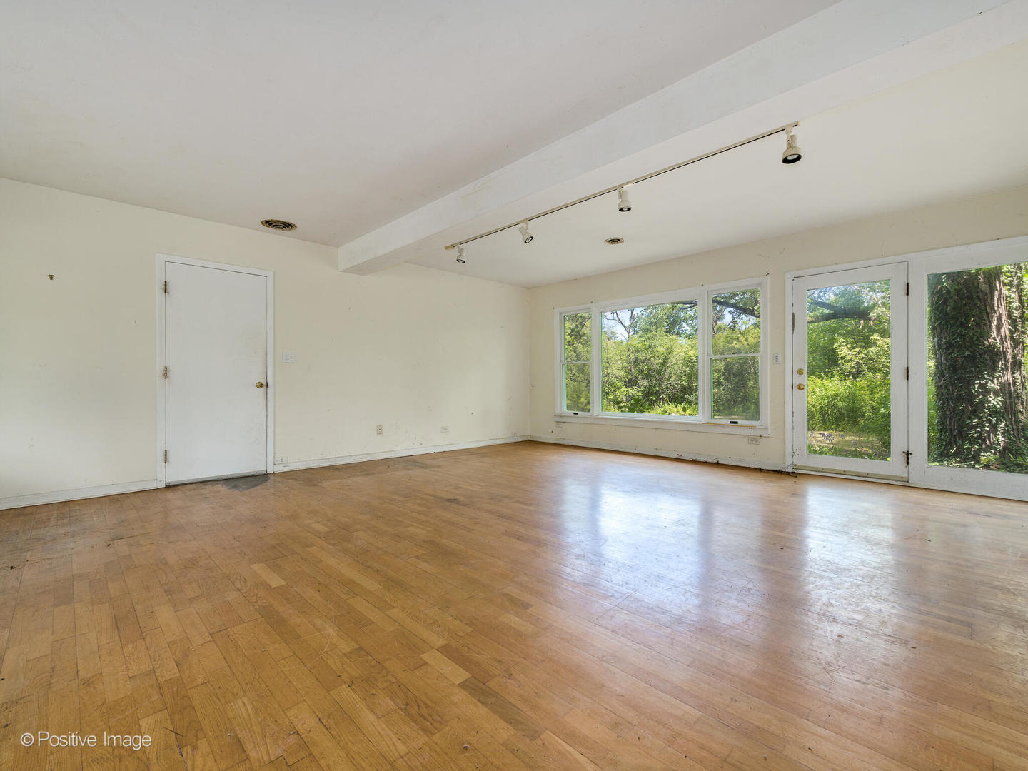 1360 West Everett Road Lake Forest, IL 60045 - Photo 9 of 14 an empty room with wooden floor and windows