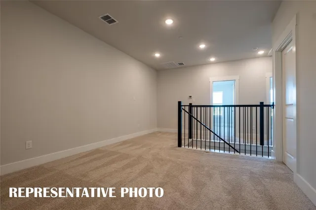 a view of kitchen with cabinets