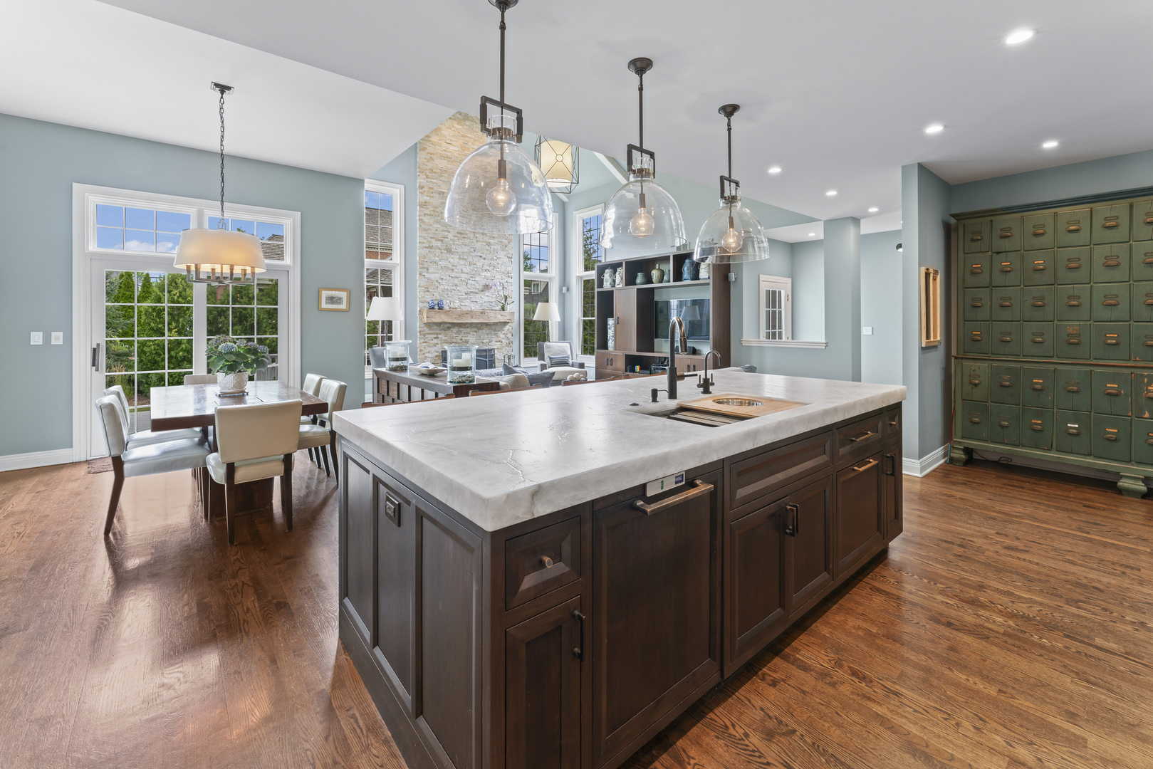 1546 Midway Lane Glenview, IL 60026 - Photo 11 of 46 a large kitchen with kitchen island granite countertop a stove a sink a island and chairs