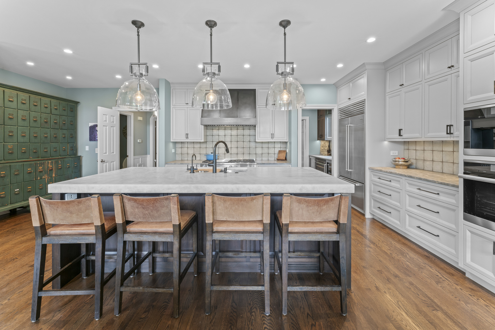 1546 Midway Lane Glenview, IL 60026 - Photo 12 of 46 a kitchen with granite countertop a table chairs stainless steel appliances and cabinets