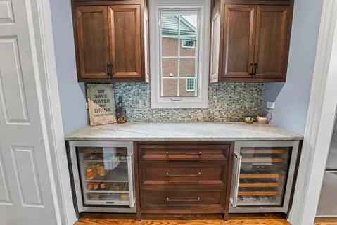 a kitchen with granite countertop cabinets and a refrigerator