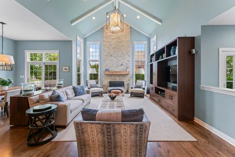 a living room with fireplace furniture and a flat screen tv