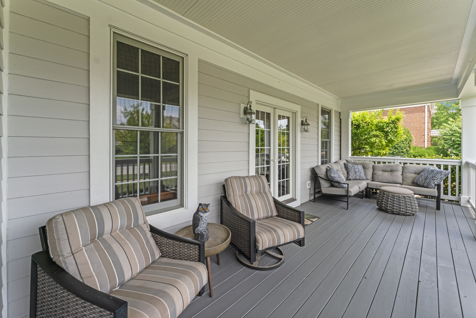 1546 Midway Lane Glenview, IL 60026 - Photo 2 of 46 a balcony with couches and potted plant on a table