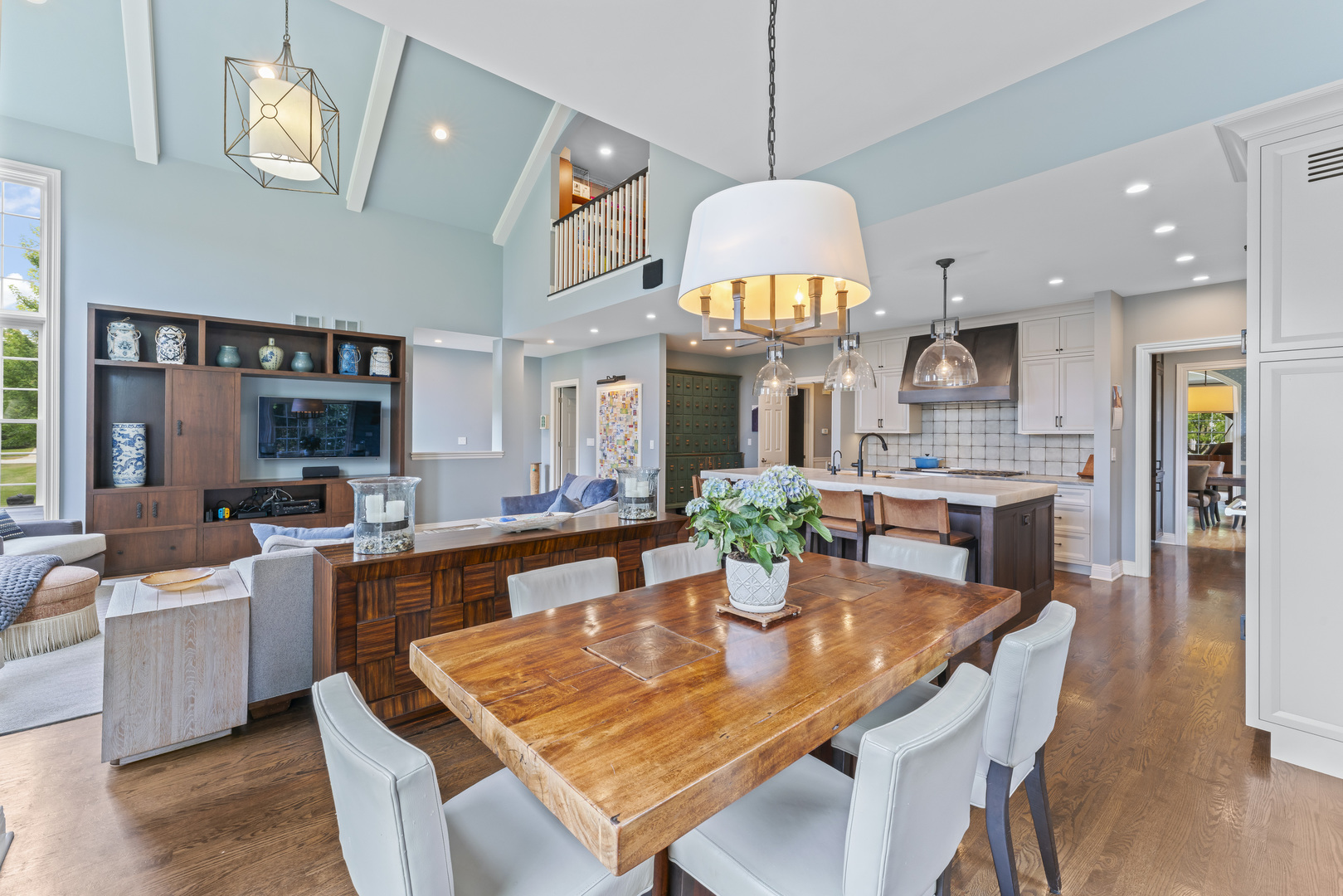 1546 Midway Lane Glenview, IL 60026 - Photo 21 of 46 a view of a dining room and livingroom with furniture wooden floor a chandelier