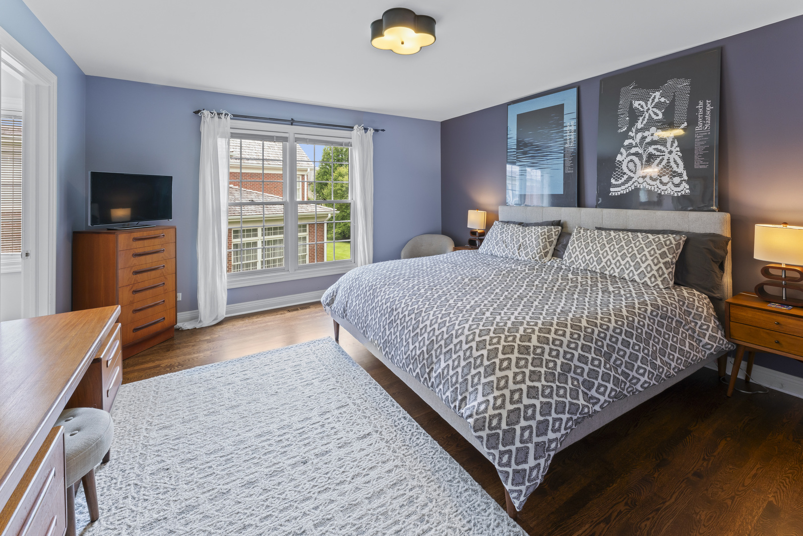 1546 Midway Lane Glenview, IL 60026 - Photo 28 of 46 a bedroom with a bed and a television on dresser