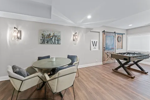 a view of a livingroom with furniture and a window