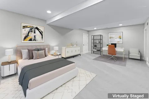 a spacious bedroom with a bed and window