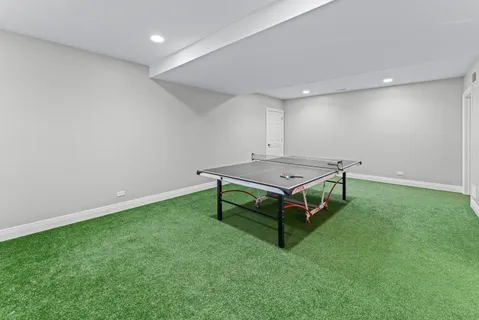 a room with pool table and a projector