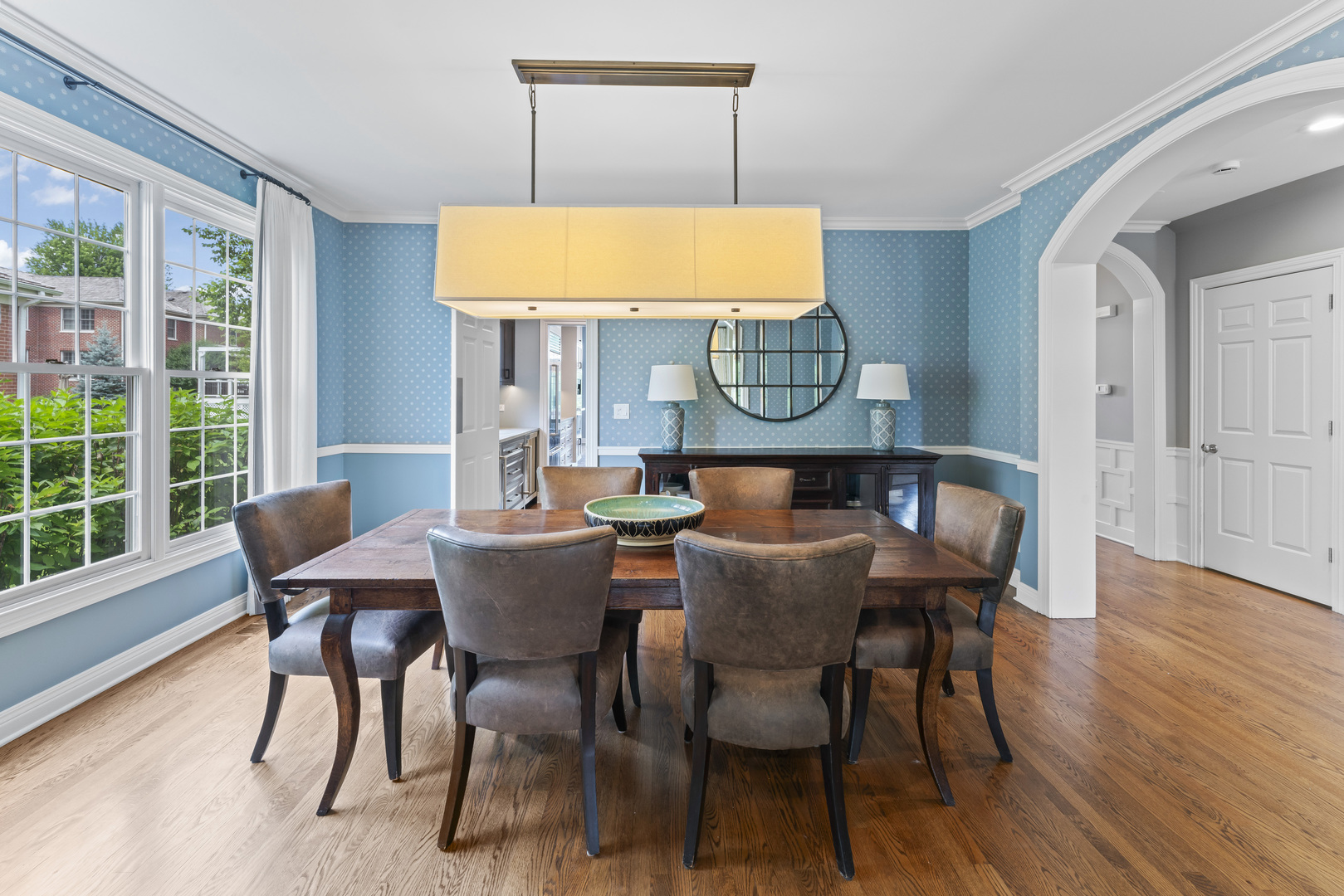 1546 Midway Lane Glenview, IL 60026 - Photo 7 of 46 a view of a dining room with furniture and wooden floor