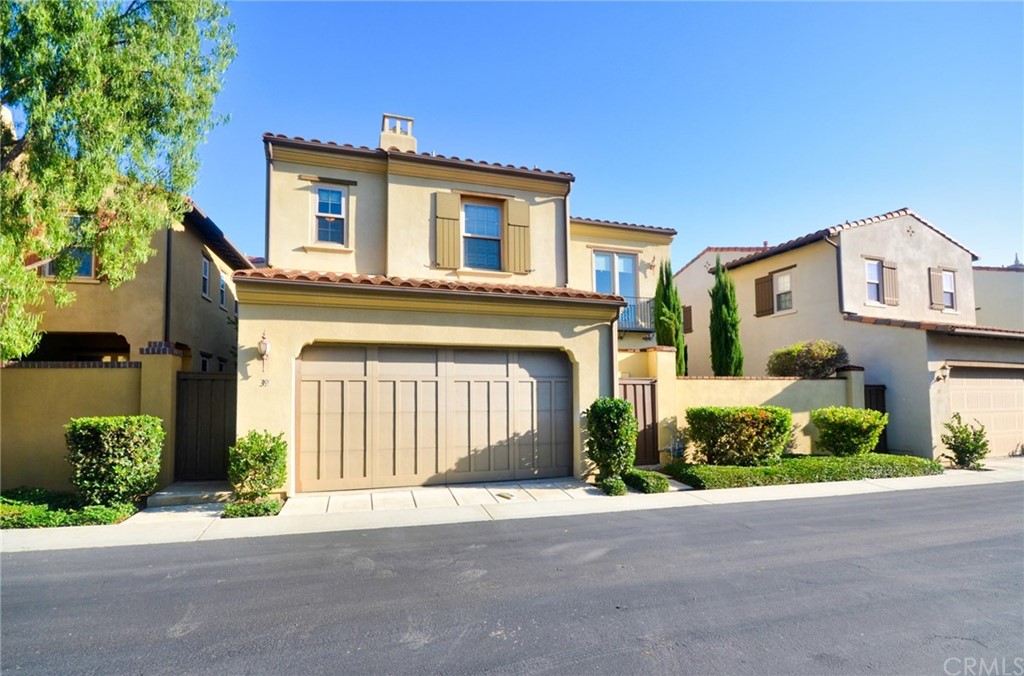 39 Conservancy Irvine, CA 92618 - Photo 2 of 32 a front view of a house with a yard and garage