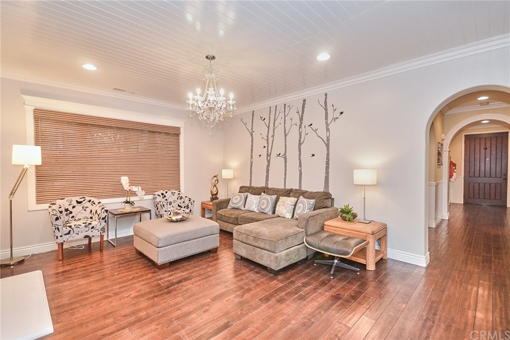 39 Conservancy Irvine, CA 92618 - Photo 13 of 32 a living room with furniture and wooden floor