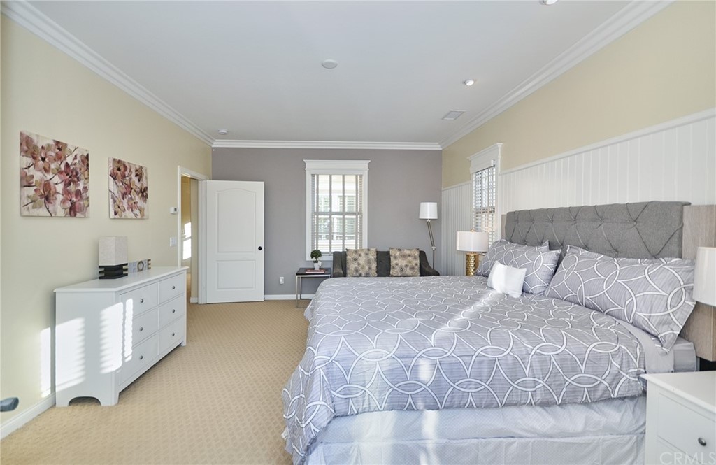 39 Conservancy Irvine, CA 92618 - Photo 19 of 32 a spacious bedroom with a bed and a cabinets