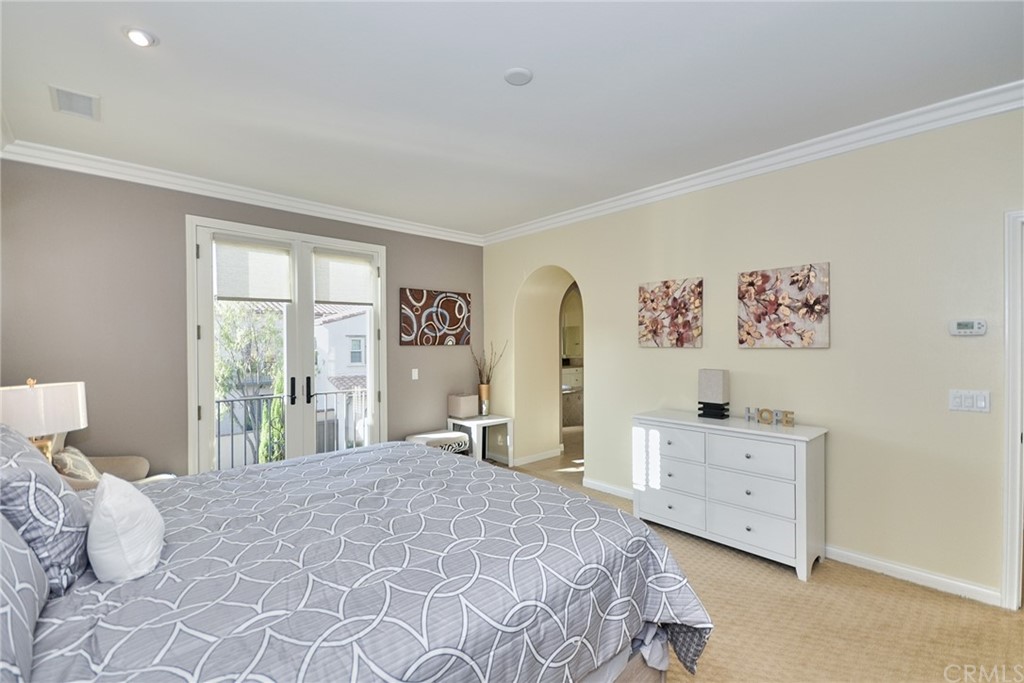 39 Conservancy Irvine, CA 92618 - Photo 20 of 32 a bedroom with a bed and window