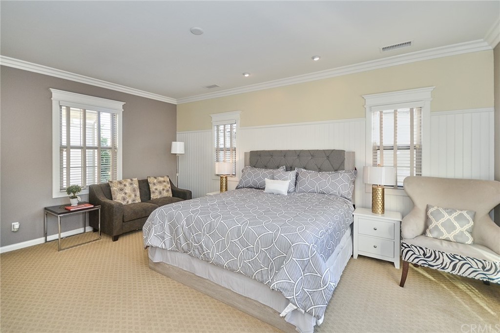 39 Conservancy Irvine, CA 92618 - Photo 22 of 32 a bedroom with a bed and a couch