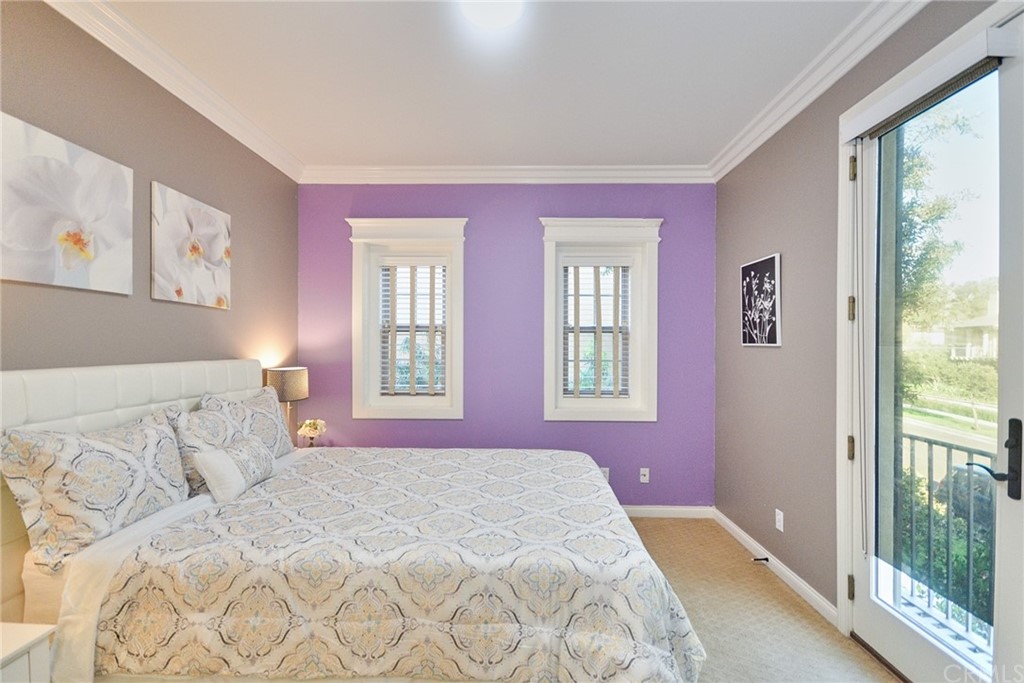 39 Conservancy Irvine, CA 92618 - Photo 26 of 32 a bedroom with a bed and a large window