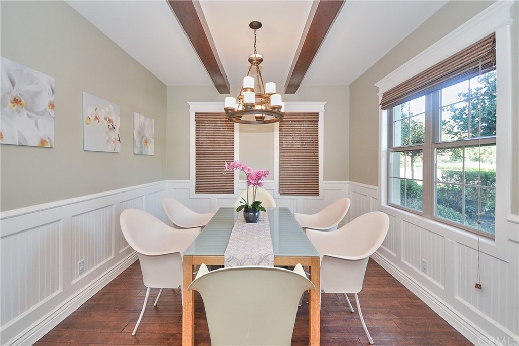 39 Conservancy Irvine, CA 92618 - Photo 5 of 32 a view of a dining room with furniture wooden floor and chandelier