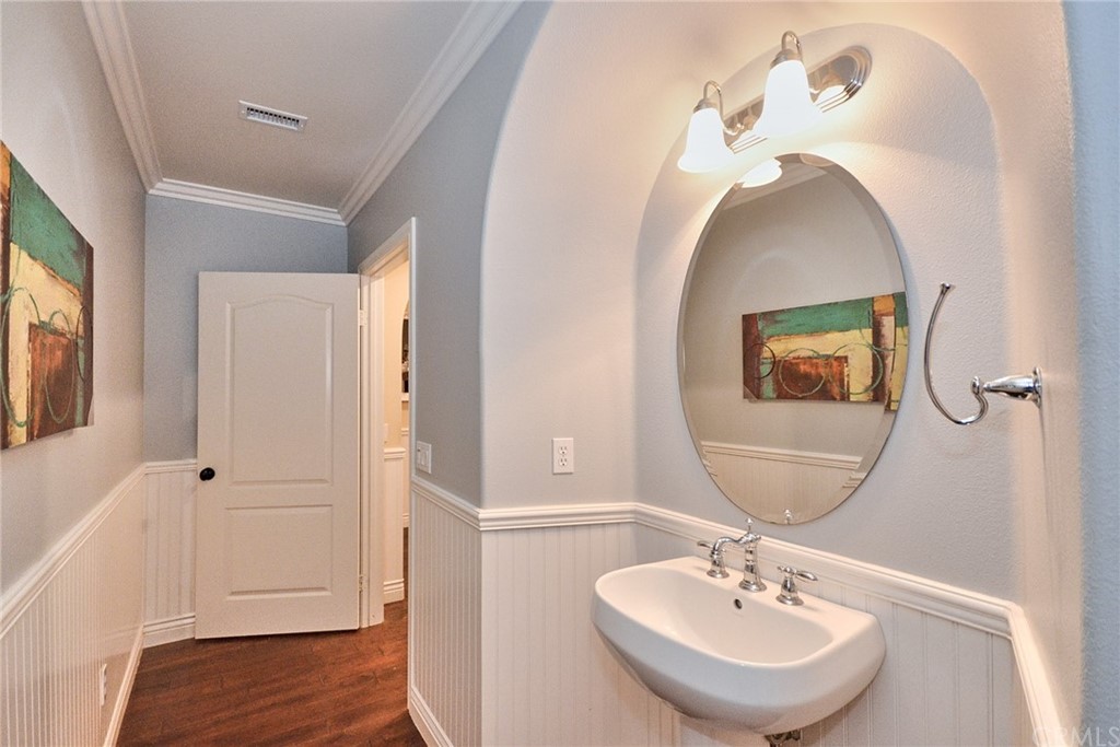 39 Conservancy Irvine, CA 92618 - Photo 7 of 32 a bathroom with a sink and a mirror