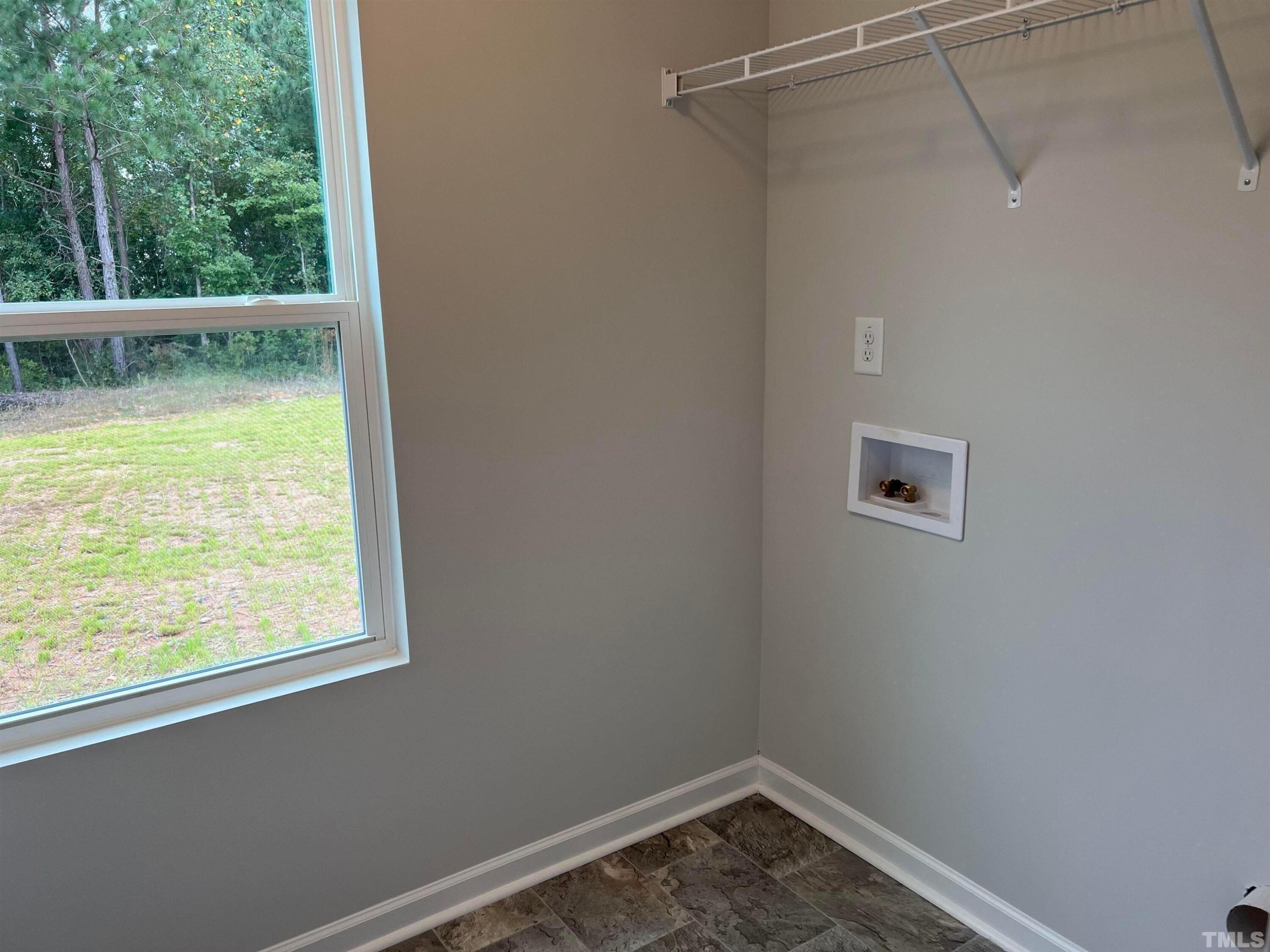 179 Maple Tree Lane Clayton, NC 27527 - Photo 9 of 18 a view of a small space with wooden floor and a window