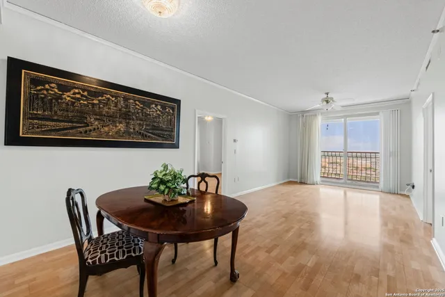 a view of a room with furniture and wooden floor