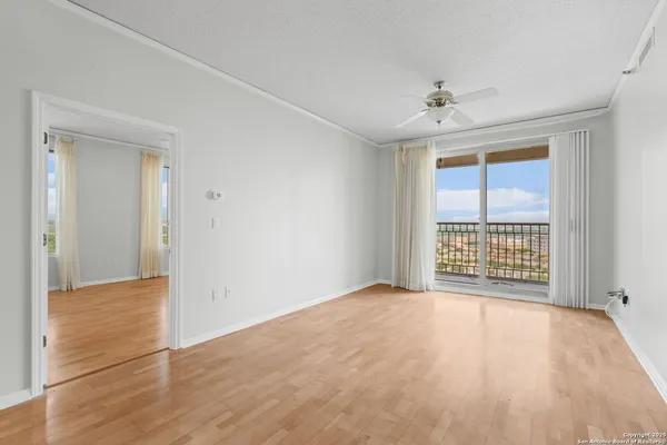 a view of an empty room with a window