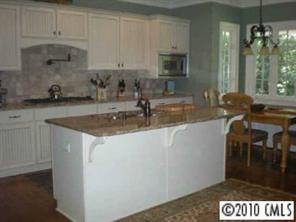 1426 Audubon Road Charlotte, NC 28211 - Photo 5 of 7 a kitchen with a sink and cabinets
