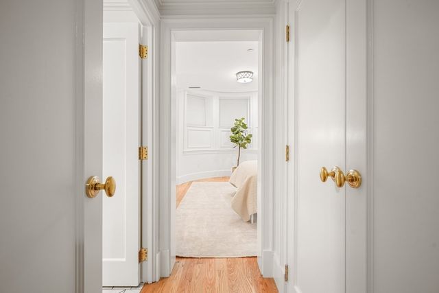 a front view of a multi story residential apartment building with a yard