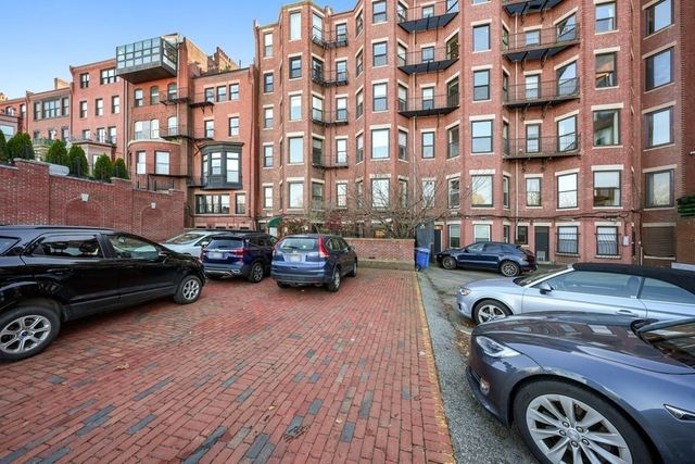 an aerial view of a building with outdoor space sitting space