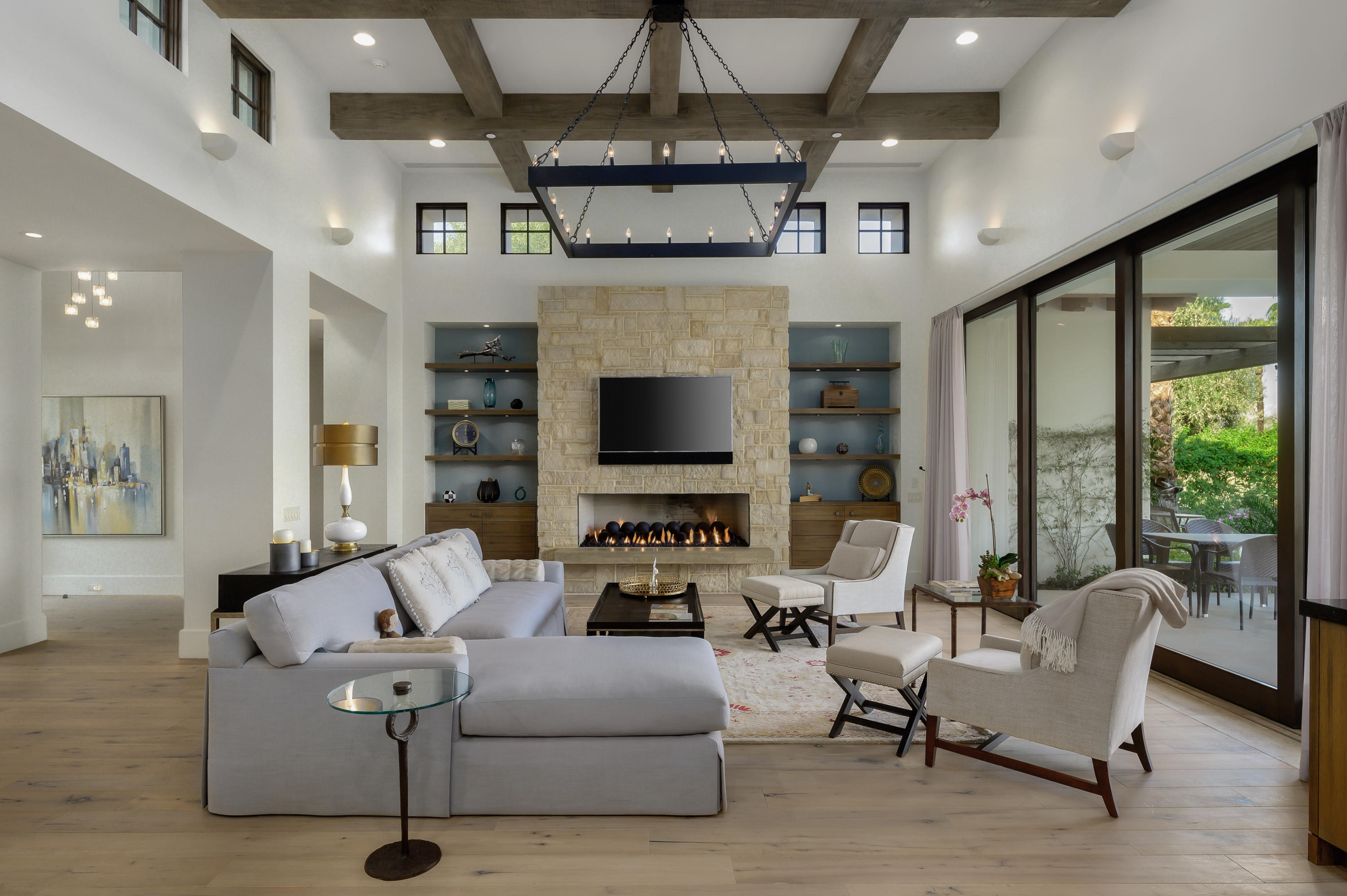 a living room with furniture ceiling fan and a fireplace