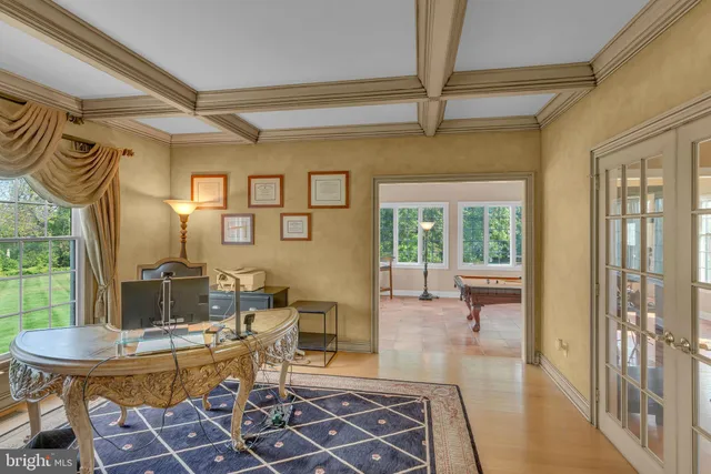 a kitchen with a sink a counter top space and stainless steel appliances