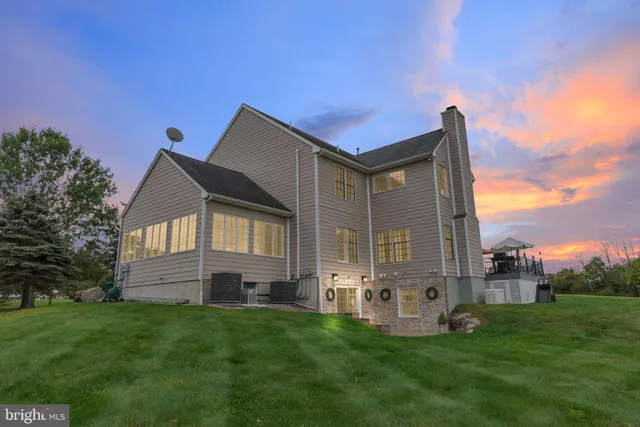 a view of entryway bedroom and hall with wooden floor