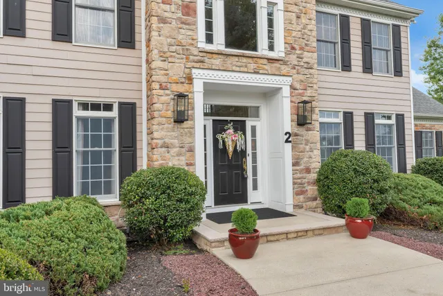 a view of a dining room with furniture wooden floor and a chandelier