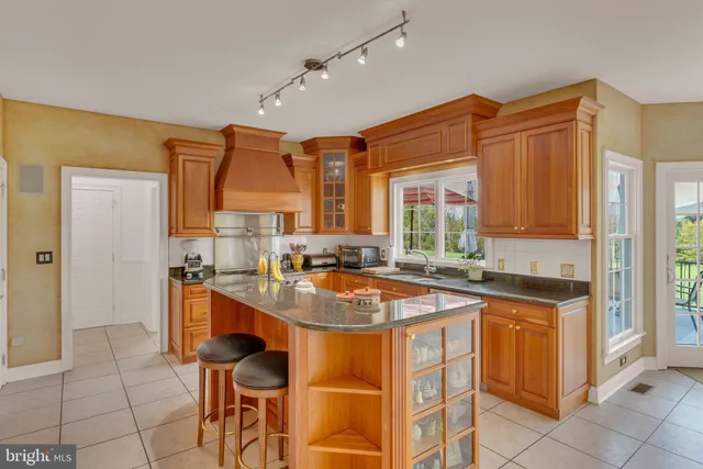 a view of staircase with white walls and wooden floor