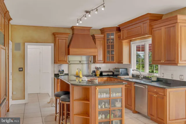 a view of a bedroom with bed and window