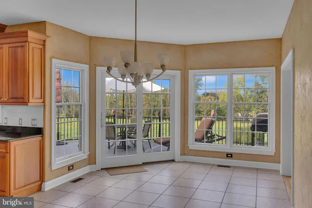 a bathroom with a tub a sink and a window
