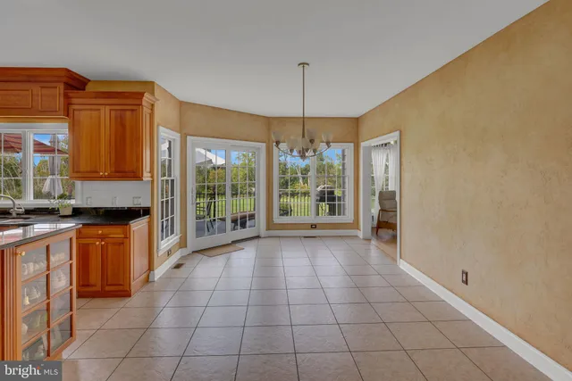 a bathroom with a sink a mirror and a window