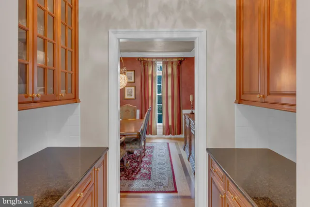 a bathroom with a sink mirror and toilet